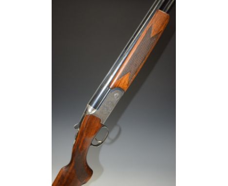 Lincoln 12 bore over and under ejector shotgun with engraved scenes of dogs and birds to the lock, floral engraving to the tr