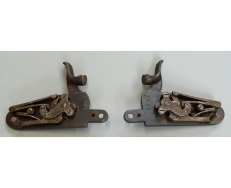 A pair of percussion hammer action gun locks with line engraved plates impressed 5756.&nbsp;