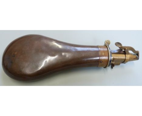 Copper and brass powder flask with nozzle marked M Marsh Sheffield and body stamped Bartram &amp; Co, 22cm long.&nbsp;