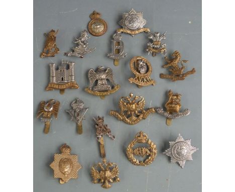 Nineteen British Army Dragoon Guards/Dragoons cap badges including 5th Kings Dragoon Guards (J R Gaunt makers), Royal Scots G