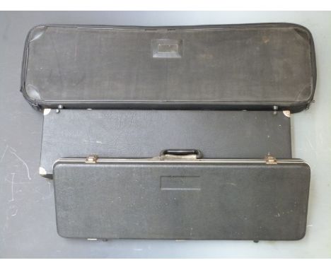 Three shotgun or rifle carry cases, largest 96 x 28 x 11cm.&nbsp;