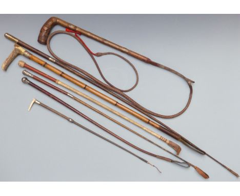 A collection of vintage riding crops, whips and sticks including hallmarked silver mounted examples&nbsp;