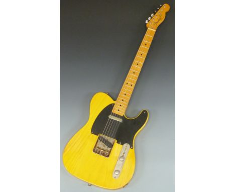Fender American vintage 1952 re-issue Telecaster, butterscotch blonde with black scratch plate, no serial number, in fitted c