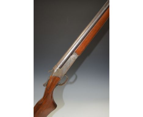 H W Cooey Model 84 12 bore single barrelled shotgun with named lock, semi-pistol grip and 30 inch barrel choked ¾, overall le