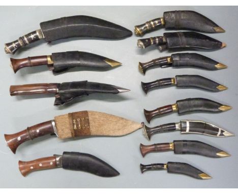 Thirteen kukris some G K &amp; Co Nepal, all with sheaths, largest blade 20cm. PLEASE NOTE ALL BLADED ITEMS ARE SUBJECT TO OV