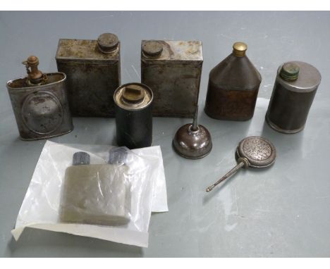 Nine vintage oil bottles including some with military marks.&nbsp;