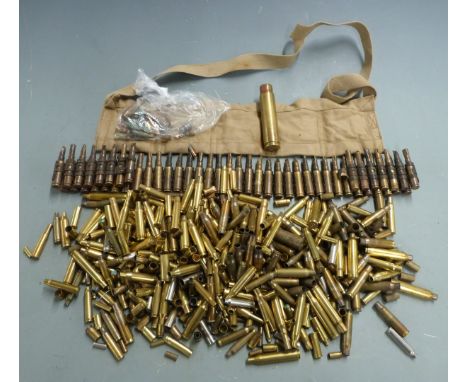 A collection of collector's brass rifle cartridges of various calibres including 20mm, 7mm Mauser, .22, .220, .222, 9mm Luger