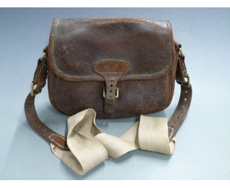 Vintage leather shotgun cartridge bag with canvas shoulder strap.&nbsp;