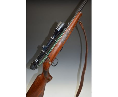 Anschutz model 1416 .22 bolt action rifle with chequered semi-pistol grip and forend, two spare magazines, leather sling, ASI