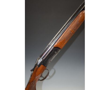 Valmet 12 bore over and under shotgun with pattern engraved locks, single trigger, chequered and patterned semi-pistol grip a