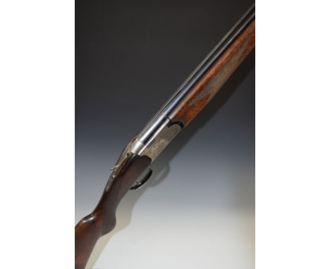 Webley & Scott Model 900 12 bore over and under ejector shotgun with engraved lock, underside and thumb lever, chequered semi
