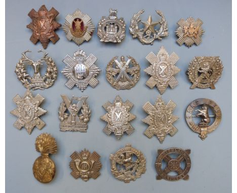 Nineteen British Army and Scottish Regiments badges including Royal Scots, Highland Light Infantry, Gordon Highlanders, Black
