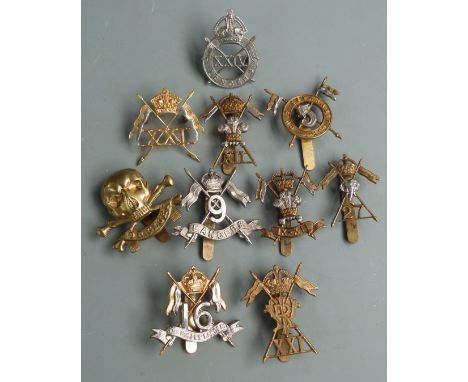 Ten British Army Lancer Regiments cap badges including 9th Lancers (J R Gaunt makers), 21st Lancers and 16th Lancers etc