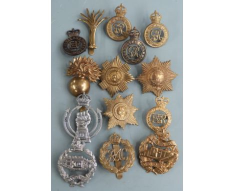 Fourteen British Army Household Division and Royal Armoured Corps cap badges including Blues and Royals, Welsh Guards and Tan
