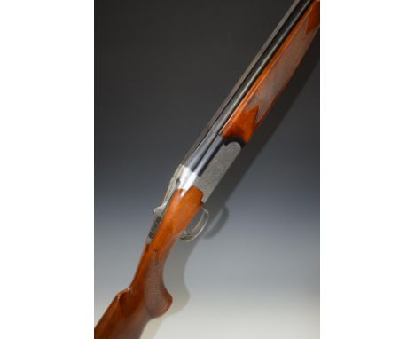 Browning Medalist 12 bore over and under ejector shotgun with named and ornately engraved lock, underside, trigger guard, top
