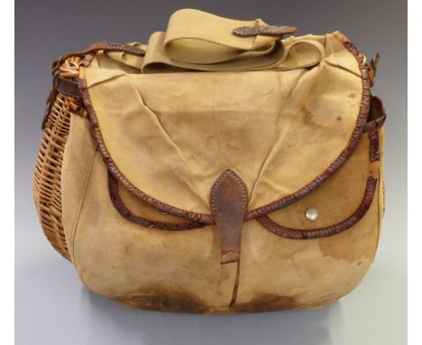 Vintage wicker fishing creel with external canvas and leather pockets.&nbsp;