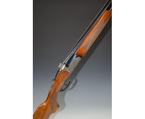 Domino12 bore over and under ejector shotgun with engraved lock, trigger guard, underside, top plate and thumb lever, chequer