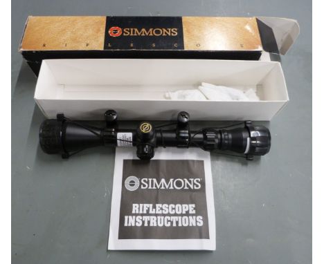 Simmons 800878 8-Point 3-9x40 rifle scope with lens covers and scope mounts, in original box.&nbsp;