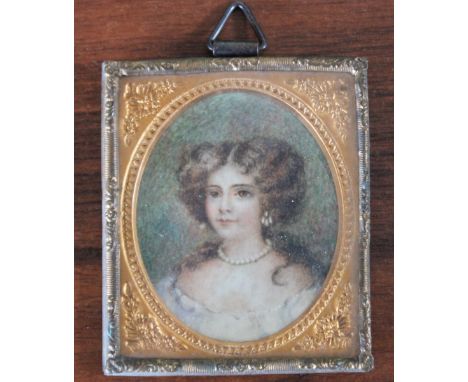 A LATE 19TH / EARLY 20TH CENTURY OVAL MINIATURE PORTRAIT STUDY OF A YOUNG WOMAN, unsigned, watercolour on card, framed and gl