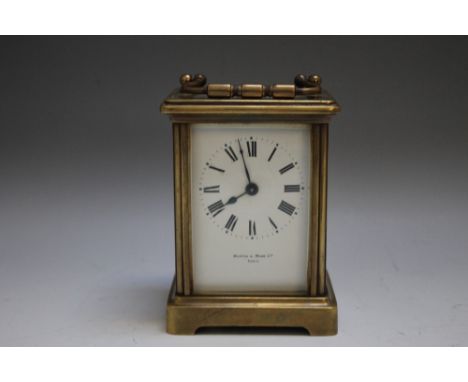 A BRASS CASED 'MAPPIN & WEBB' CARRIAGE CLOCK, enamel face with Roman numerals, Mappin & Webb Ltd., London to bottom of dial, 