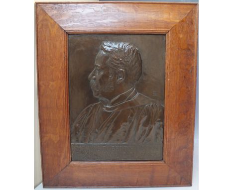 AN ARTS AND CRAFTS COPPER PORTRAIT PANEL OF A GENTLEMAN, the image in relief form, panel below reading 'SIR W.C. ROBERTS-AUST