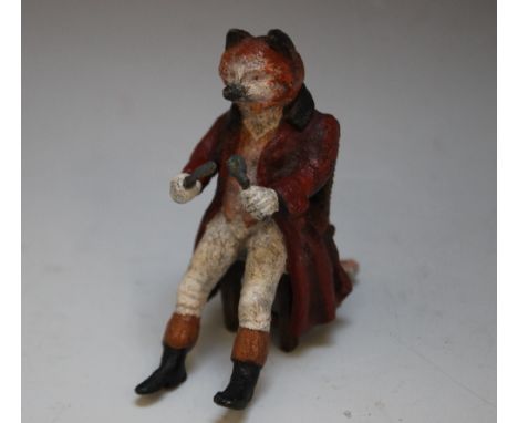 A 19TH CENTURY STYLE COLD PAINTED BRONZED FIGURE OF A SEATED FOX WITH KNIFE AND FORK, H 6.5 cm