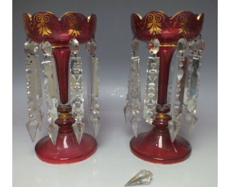 A PAIR OF BOHEMIAN RUBY AND GILT GLASS LUSTRES, having scalloped shaped rims and fluted stems, H 25.3 cm