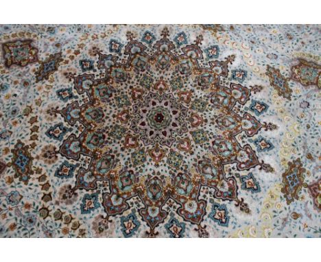 A LARGE ANTIQUE CIRCULAR WOOLLEN RUG, having central Eastern cartouche, floral design throughout, with further floral concent