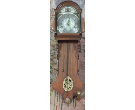 AN OAK CASED 19TH CENTURY 30 HOUR DUTCH WALLCLOCK WITH ALARM BELL, the painted arched dial with silvered chapter ring and Rom