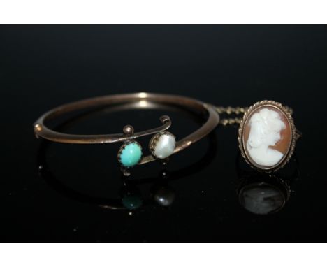 A YELLOW METAL BRACELET SET WITH A TURQUOISE AND A PEARL, together with a yellow metal cameo ring of typical form, approx wei