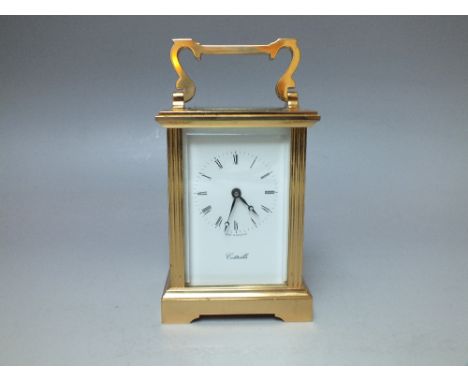 A BRASS CASED CARRIAGE CLOCK RETAILED BY 'COTTRILLS', the enamel dial with Roman numerals, the movement stamped 'L'Epee, Made