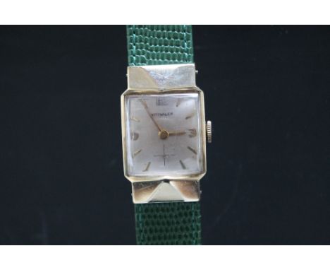 AN ART DECO WITTNAVER 10K GOLD FILLED GENTS WRIST WATCH, having silvered dial, deco style arrow head hour markers, Arabic num