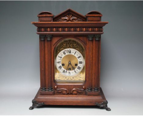 A LATE 19TH / EARLY 20TH CENTURY OAK CASED QUARTER CHIMING  BRACKET CLOCK, the gilt face with silvered chapter ring and Roman