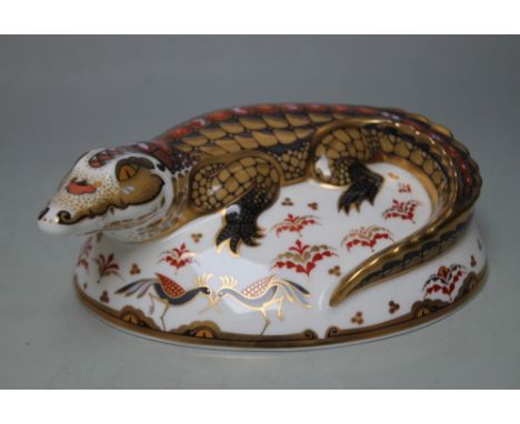 A ROYAL CROWN DERBY PAPERWEIGHT IN THE FORM OF A CROCODILE, printed marks to base, gold stopper, W 15.5 cm