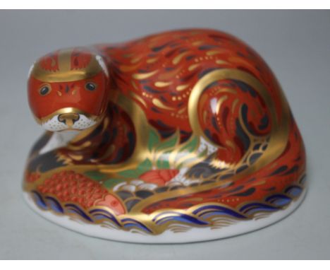 A ROYAL CROWN DERBY PAPERWEIGHT IN THE FORM OF AN OTTER, printed marks to base, gold stopper, W 11.5 cm