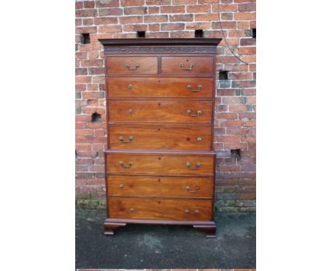 A 19TH CENTURY MAHOGANY CHEST ON CHEST, the cornice with blind carved detail. the upper section with two short above three lo