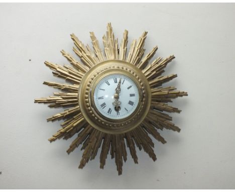 AN EARLY 20TH CENTURY GILT WOOD FRENCH SUNBURST WALL CLOCK, with a 'Japy Freres' stamped movement, Dia. 31 cm
