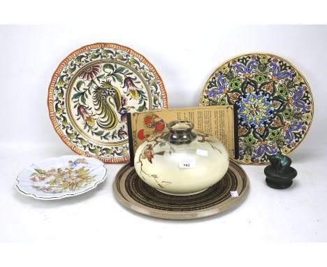 An assortment of ceramics. Including a Poole pottery plate, Outeiro plate, Portuguese plate, signed pottery vase etc