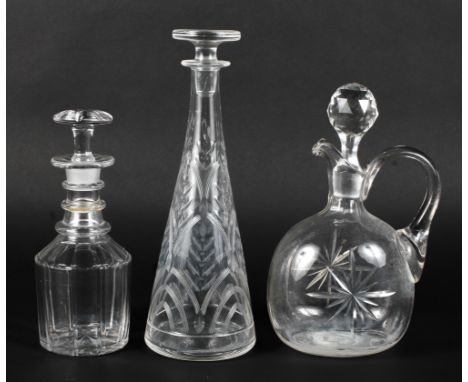 Three glass decanters. Various ages, including a Georgian ring neck decanter, tallest H31cm