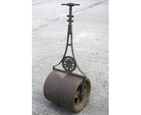  A Victorian garden roller with central round motif pierced with a flower basket. H118cm