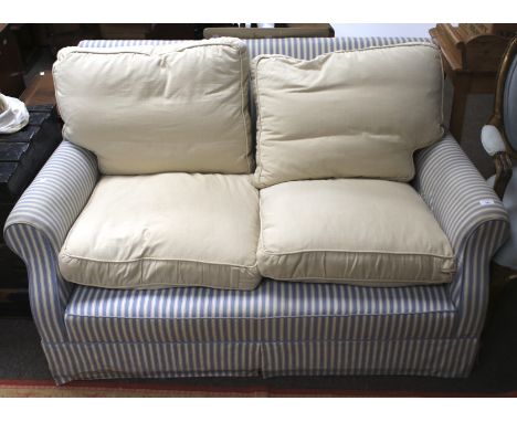 An early 20th century two-seater sofa. With blue and white striped covering, L142cm x H76cm