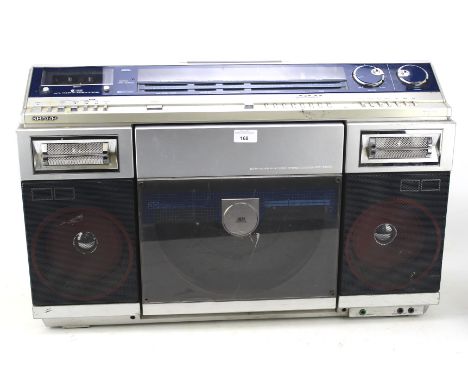 A vintage Sharp VZ-2000 disk stereo system. L73cm Condition Report: No cord present. Unable to test whether functioning.