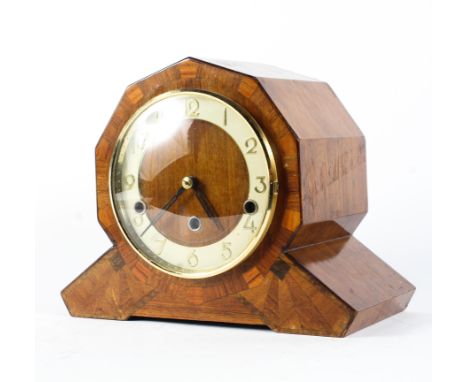 A Continental Art Deco Westminster chimes oak veneered mantel clock. The dial with coloured chapter ring and gilt metal Arabi