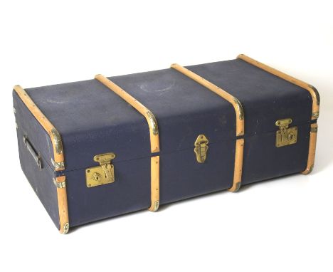 A vintage travelling trunk. With wooden mounts, handles to either end and brass latches, L91cm x D52cm x 33cm
