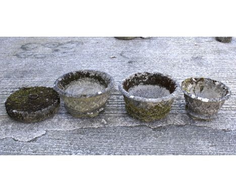 Three stone pots and horse tether with ring. The pots decorated in relief with basketwork pattern, max. diameter 50cm