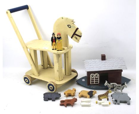 A vintage wooden push horse and a Noah's ark, both painted, the ark containing an assortment of animals, horse H49cm