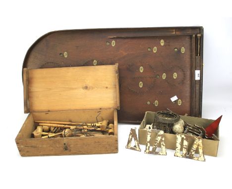 Three vintage games. Comprising a miniature croquet set in a wooden case, mahogany pinball board and a miniature golf set.