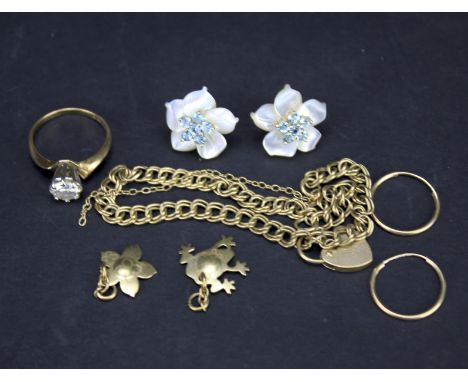 An assortment of gold and yellow metal jewellery. To include a small heart locket bracelet, ring, pair of earrings etc, appro