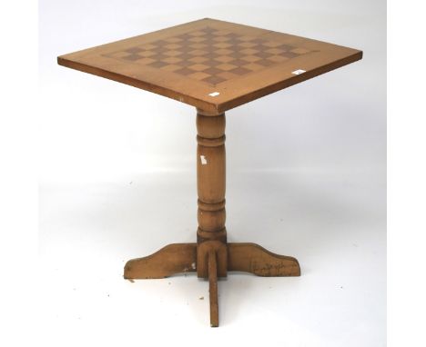 A 20th century chess top table. The top inlaid with a wooden board, raised on a turned column and four supports, L61cm x D61c