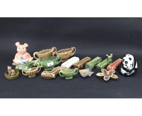 An assortment of vintage Wade ceramics. Including dishes, a Panda money bank etc